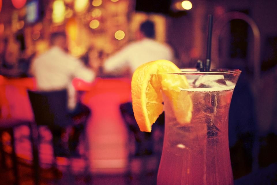 A cocktail being finished at the bar