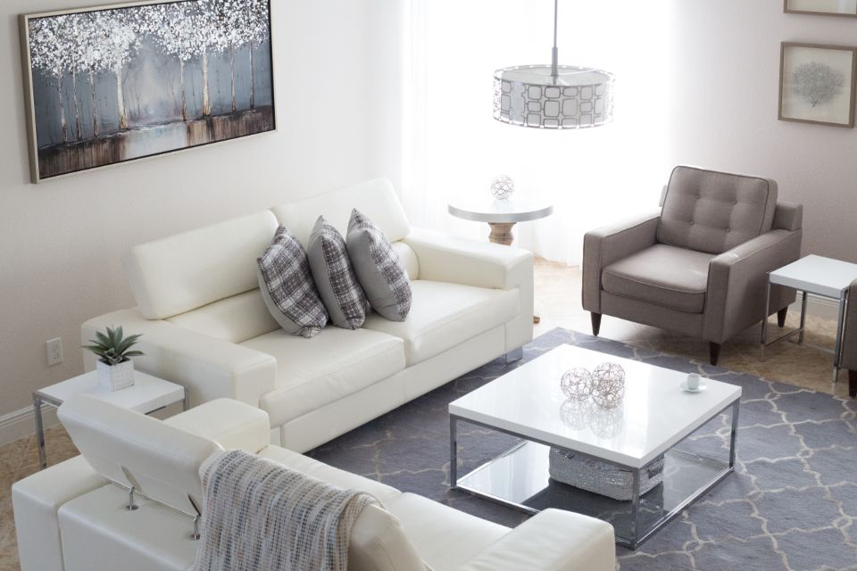 A suite sitting room with a sofa and armchairs